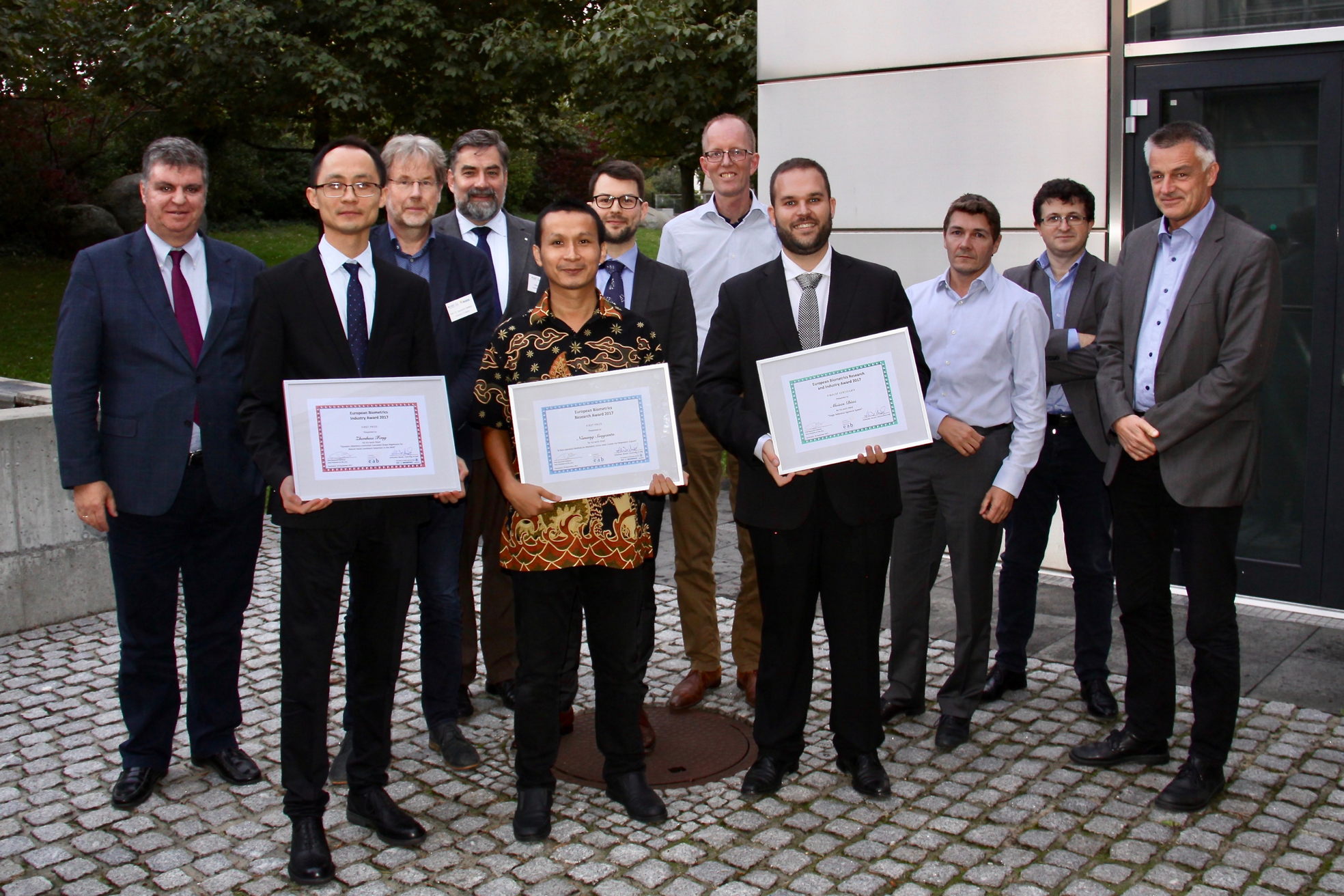 [Photo] Jury and candidates of the Awards 2017: (left to right): Javier Ortega-Garcia, Zhenhua Feng, Raymond Veldhuis, Alexander Nouak, Nanang Susyanto, Martin Olsen, Tom Kevenaar, Moises Diaz, Jean-Christophe Fondeur, S&eacute;bastien Marcel, Christoph Busch. Not in the photo: Josef Kittler, Josef Bigun