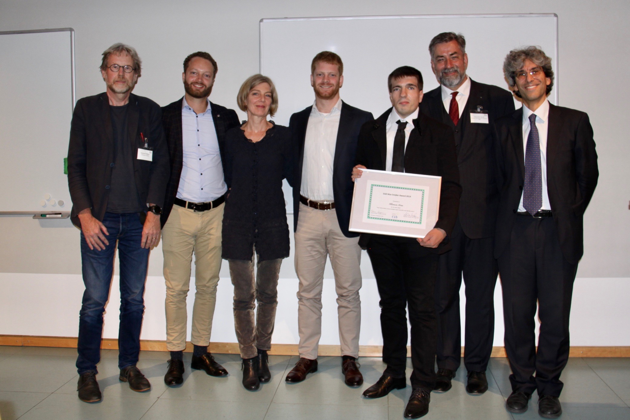 [Photo] Jury member Prof Raymond Veldhuis, Arthur Snijder, Carine Wouters, Caspar Snijder, the award winner Dr Klemen Grm together with the EAB chairman Alexander Nouak and the EAB award chair Prof Patrizio Campisi