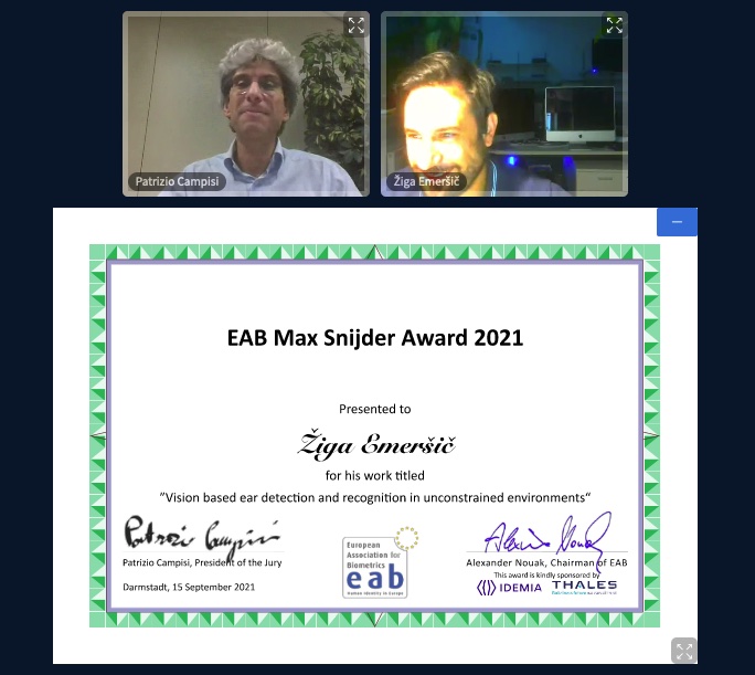 [Photo] Prof. Patrizio Campisi awarding Žiga Emer&scaron;ič with the EAB Max Snijder Award 2021