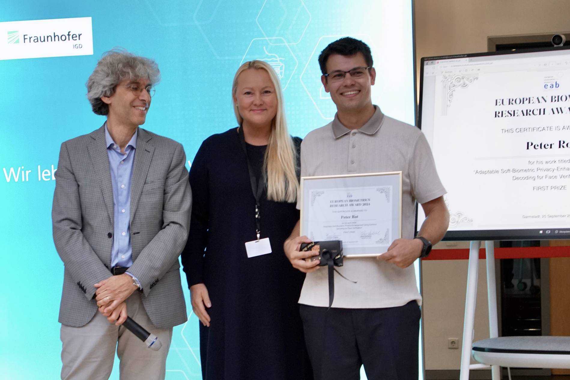 [Photo] Winner of the EAB Research Award Peter Rot together with Chairman of the Award Committee Prof. Patrizio Campisi and Chairperson of the European Association for Biometrics Fr&oslash;y L&oslash;v&aring;sdal